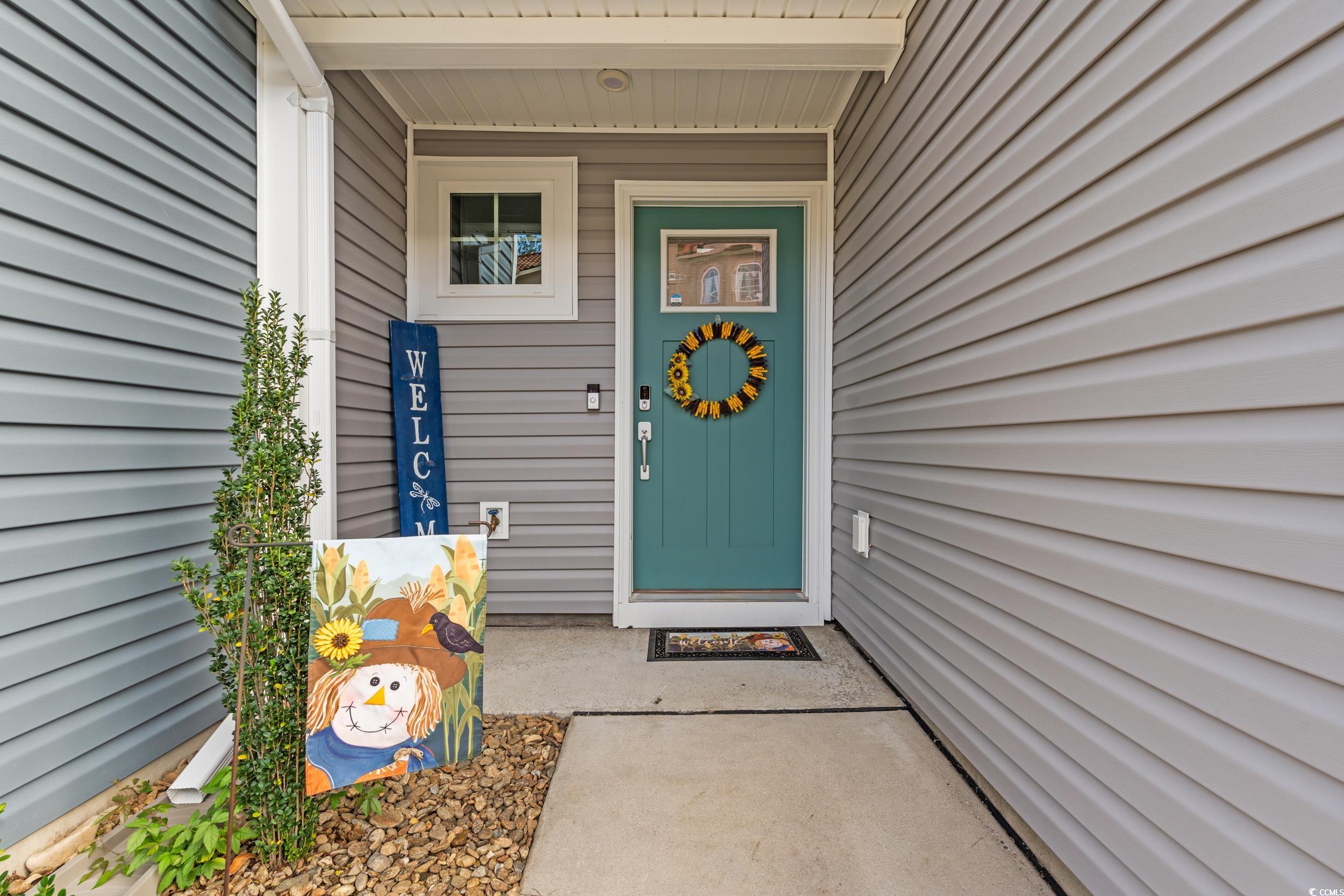 301 Granada Street, Unit D Myrtle Beach, SC 29579 - Photo 4 of 33 View of exterior entry with covered porch