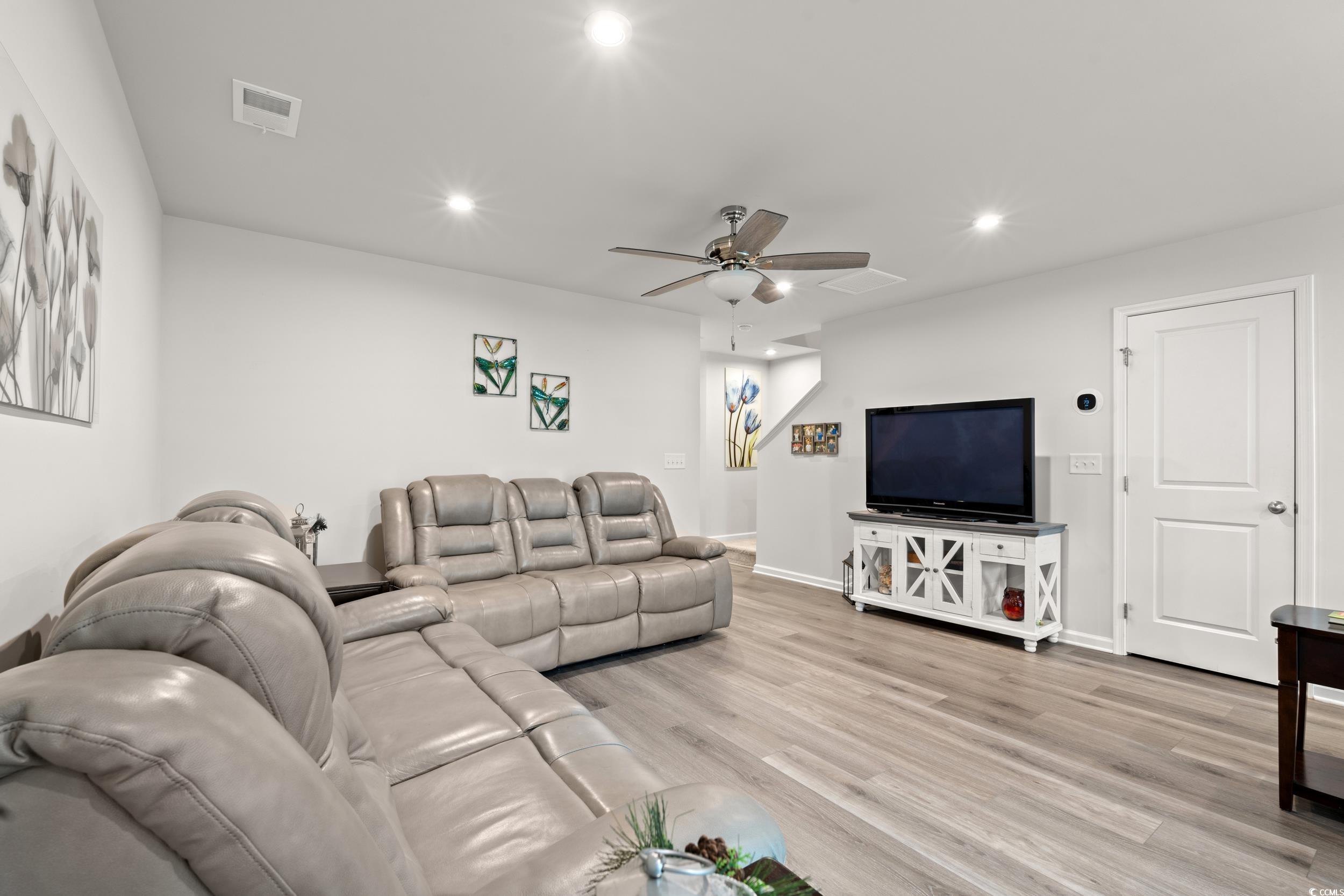 301 Granada Street, Unit D Myrtle Beach, SC 29579 - Photo 5 of 33 Living room with light wood finished floors, recessed lighting, and ceiling fan