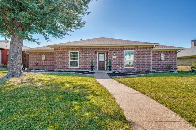 a view of house with yard outdoor seating and entertaining space
