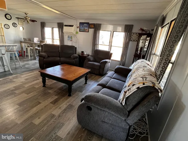 a living room with furniture and a rug