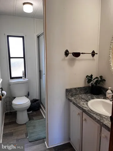 a bathroom with a sink toilet and vanity
