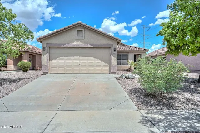 a front view of a house with yard