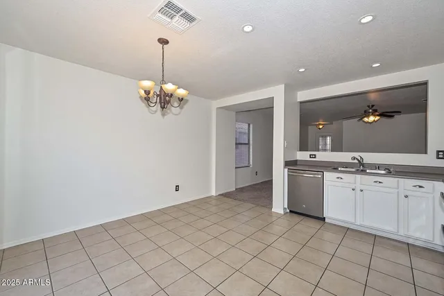 a bathroom with a granite countertop sink a mirror and a vanity