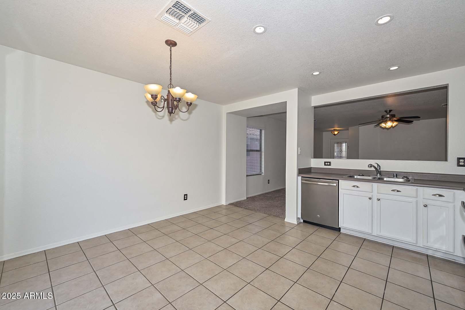 3038 West Roberta Drive Phoenix, AZ 85083 - Photo 13 of 40 a bathroom with a granite countertop sink a mirror and a vanity