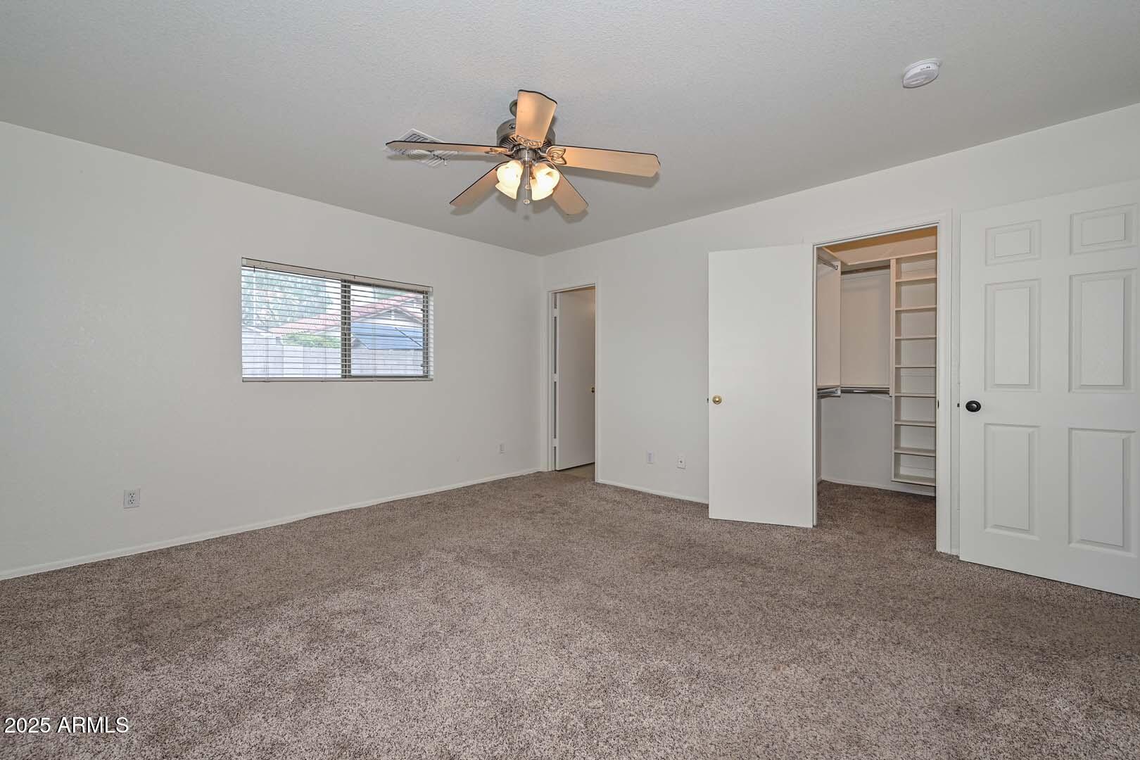 3038 West Roberta Drive Phoenix, AZ 85083 - Photo 20 of 40 a view of an empty room with a window