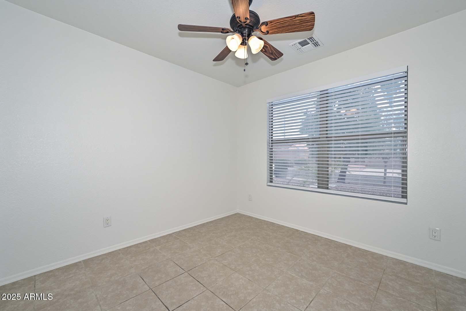 3038 West Roberta Drive Phoenix, AZ 85083 - Photo 25 of 40 a view of an empty room with a window