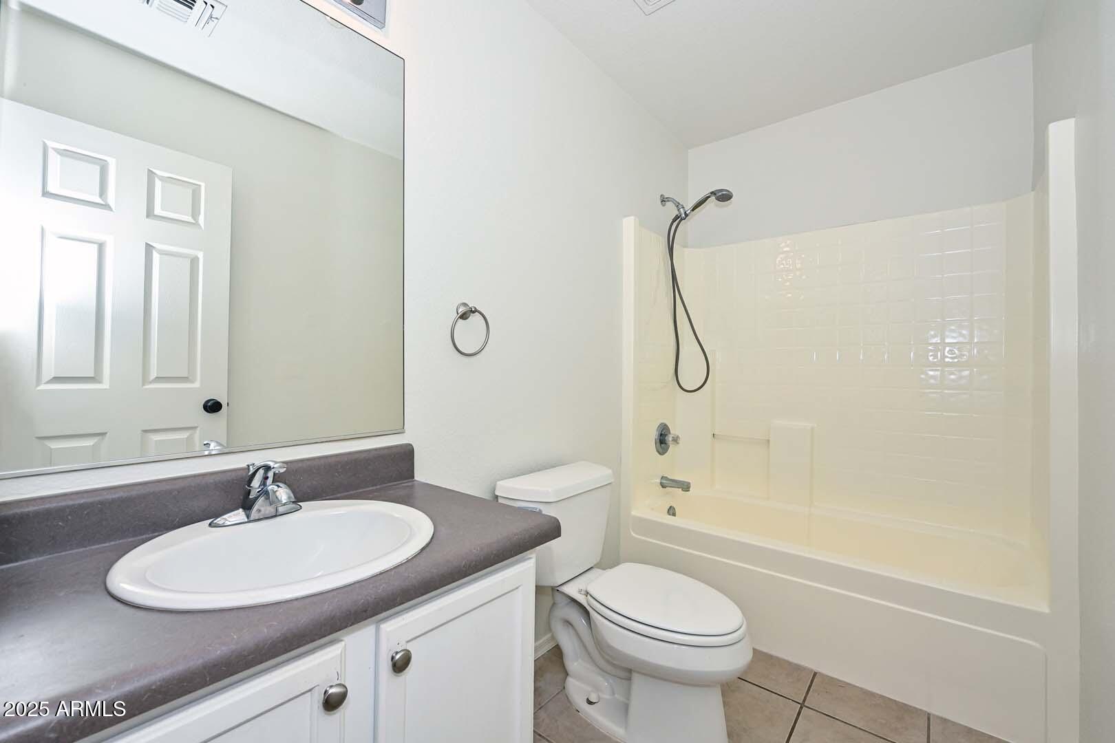 3038 West Roberta Drive Phoenix, AZ 85083 - Photo 27 of 40 a bathroom with a granite countertop sink a toilet and shower