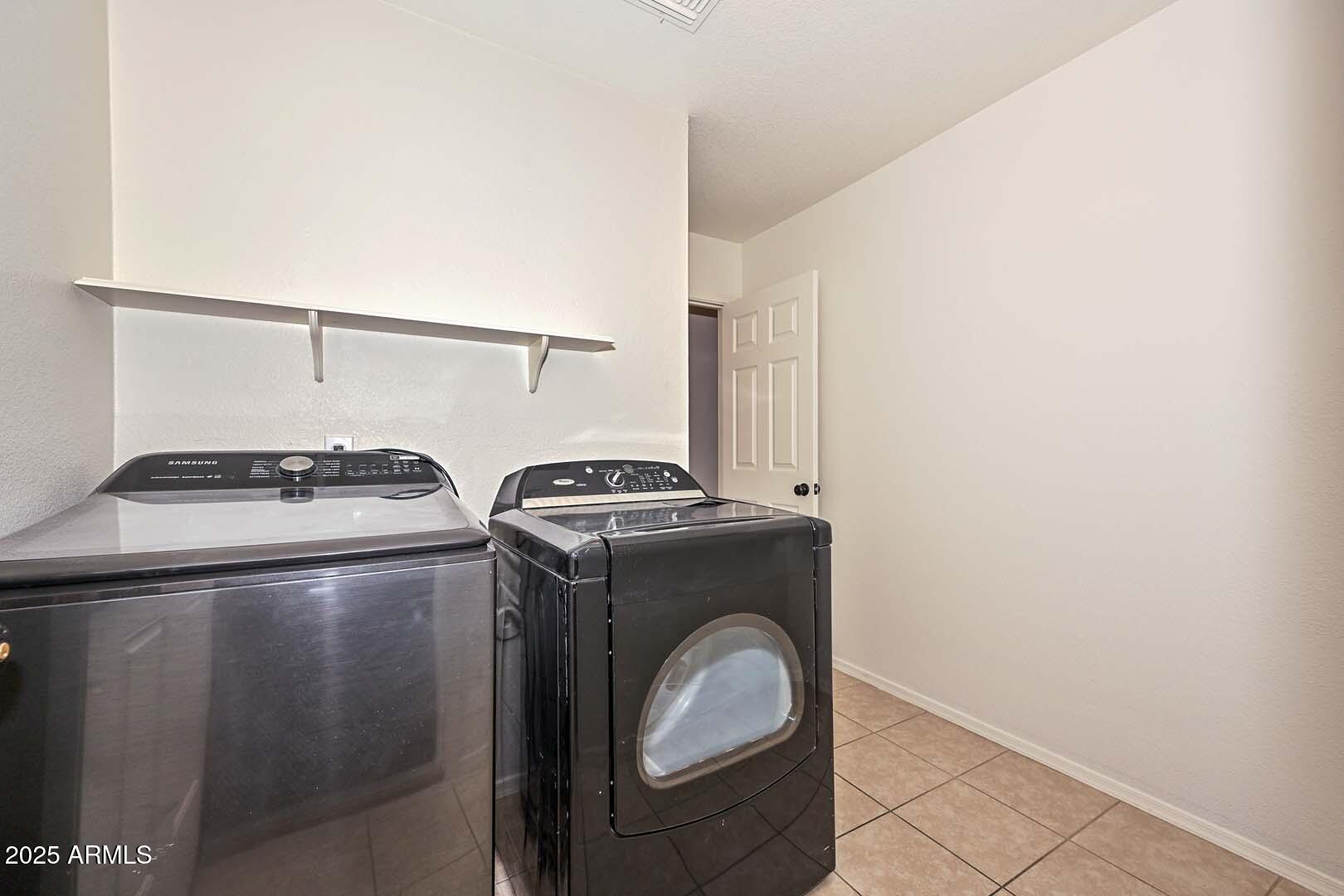 3038 West Roberta Drive Phoenix, AZ 85083 - Photo 29 of 40 a utility room with dryer and washer
