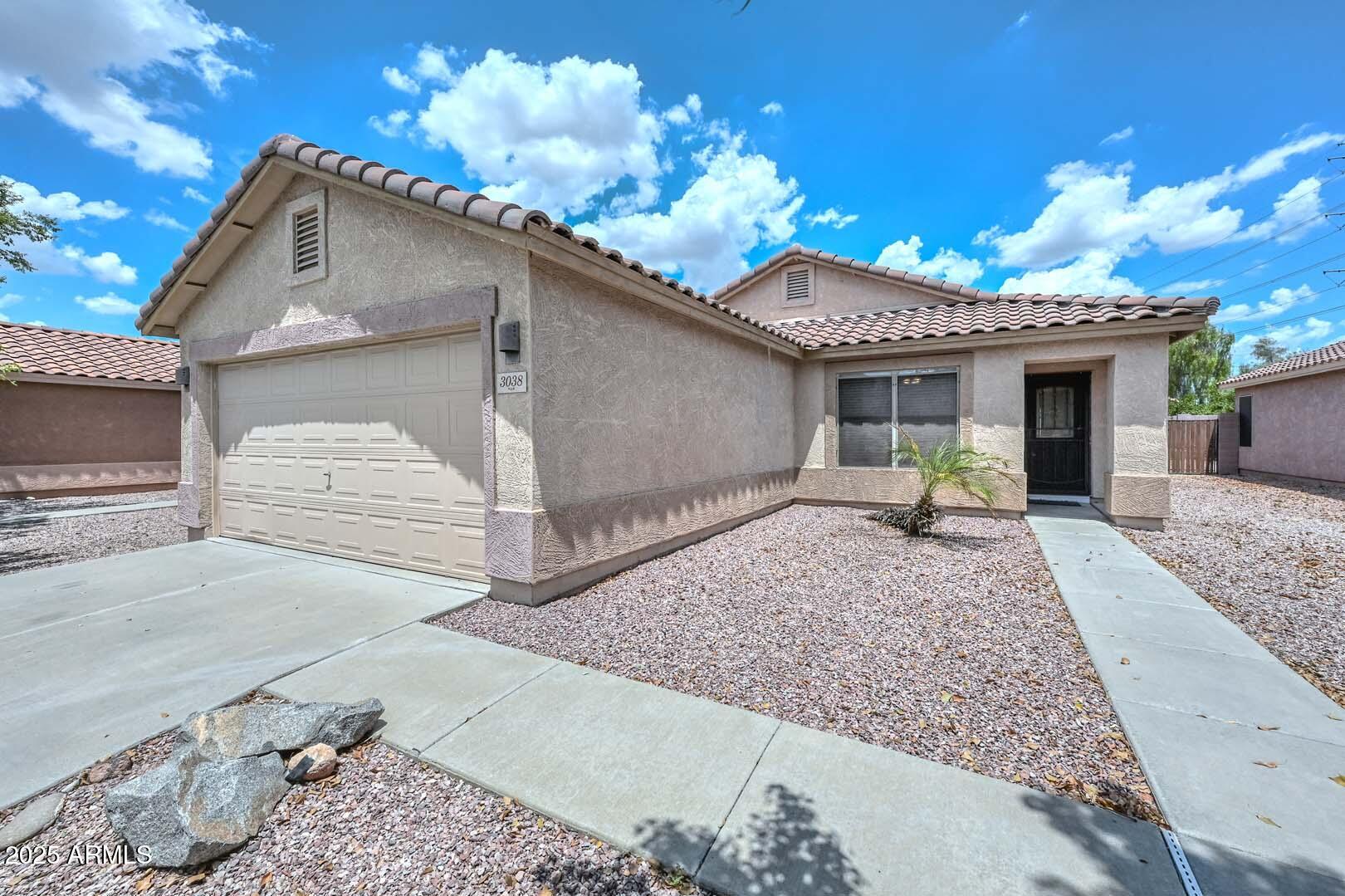 3038 West Roberta Drive Phoenix, AZ 85083 - Photo 5 of 40 a front view of a house with a yard