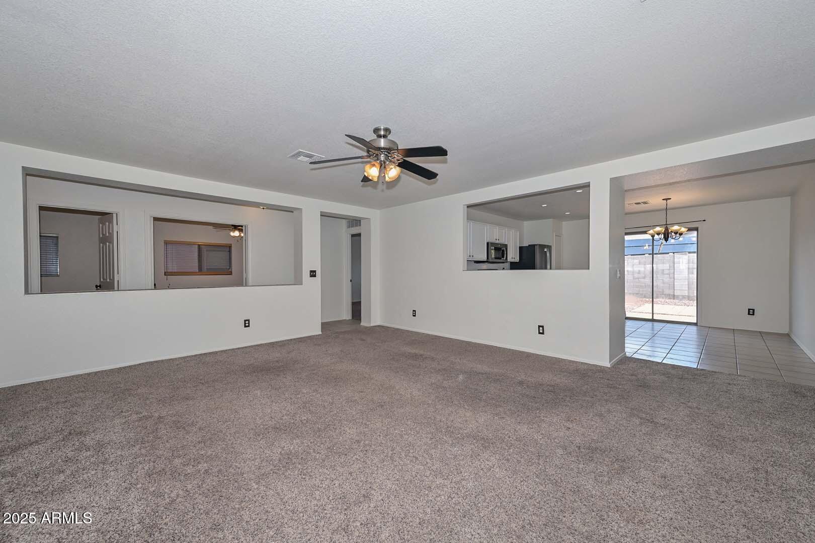 3038 West Roberta Drive Phoenix, AZ 85083 - Photo 6 of 40 a view of an empty room with a window