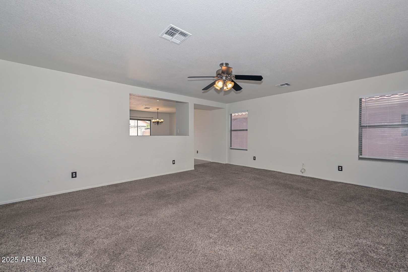 3038 West Roberta Drive Phoenix, AZ 85083 - Photo 9 of 40 a view of an empty room with a window