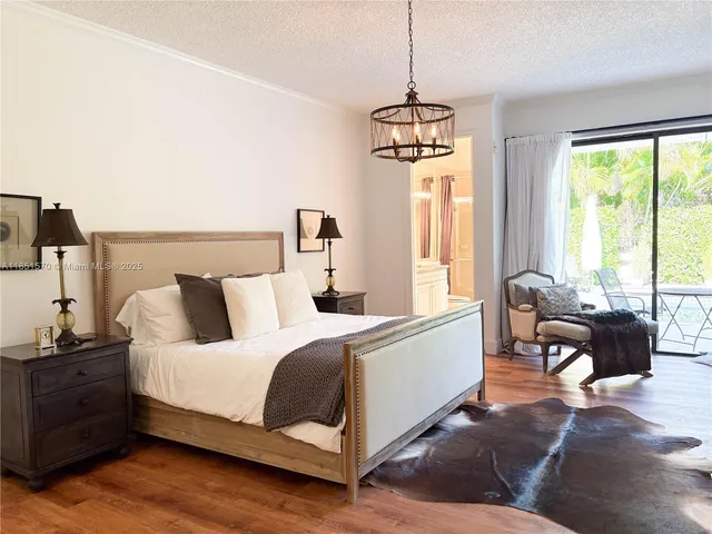 a spacious bedroom with a bed and a window