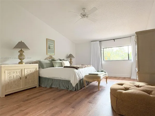 a bedroom with bed and window