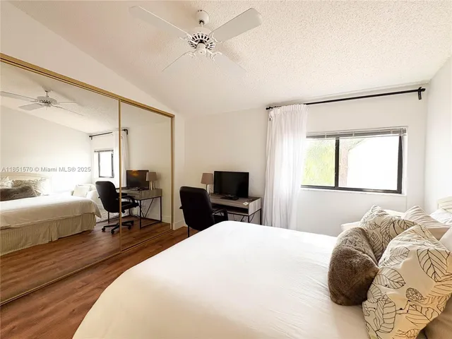 a bed room with a bed and a chair