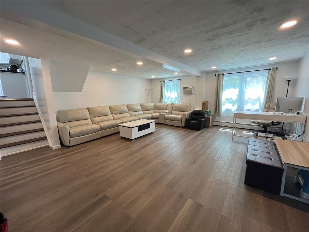 26 Venus Road Syosset, NY 11791 - Photo 3 of 8 a living room with furniture and a wooden floor