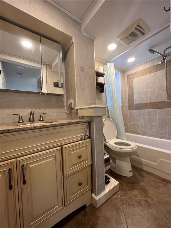 26 Venus Road Syosset, NY 11791 - Photo 8 of 8 a bathroom with a toilet a sink and bathtub