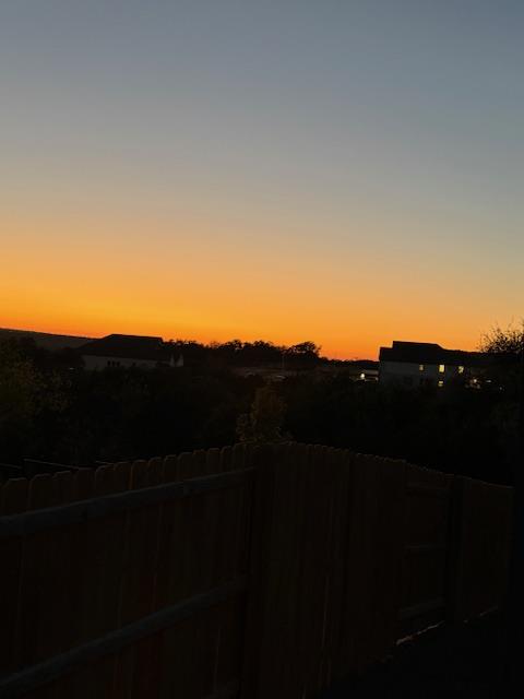 1432 Ridge Runner Drive Georgetown, TX 78628 - Photo 2 of 27 Sunset view over development from back patio