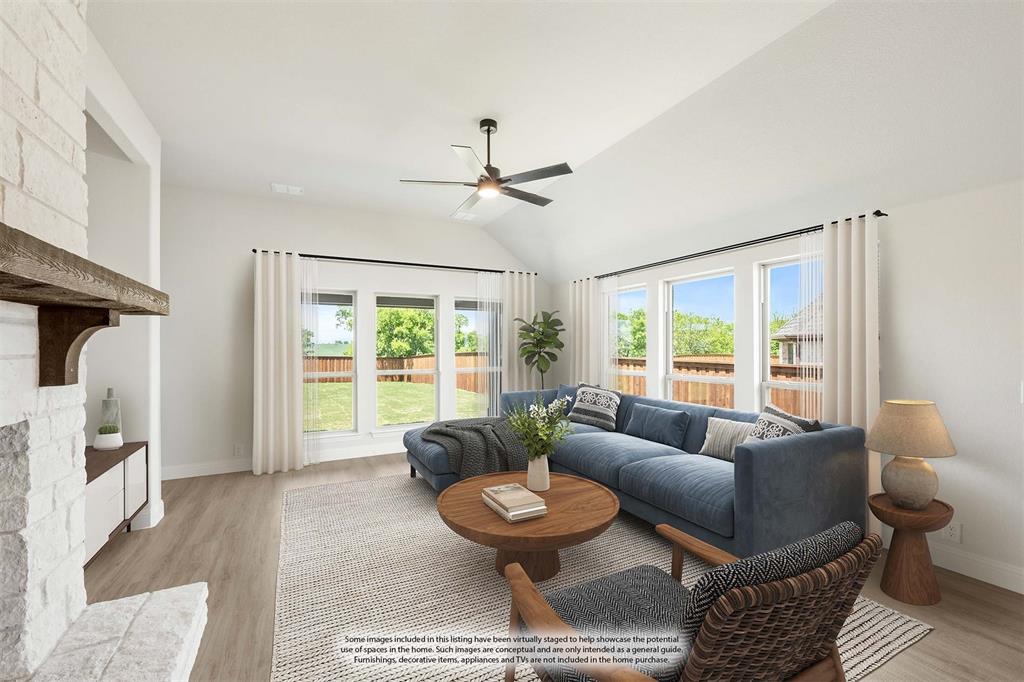 11916 Serval Street Godley, TX 76044 - Photo 14 of 35 a living room with furniture and a large window