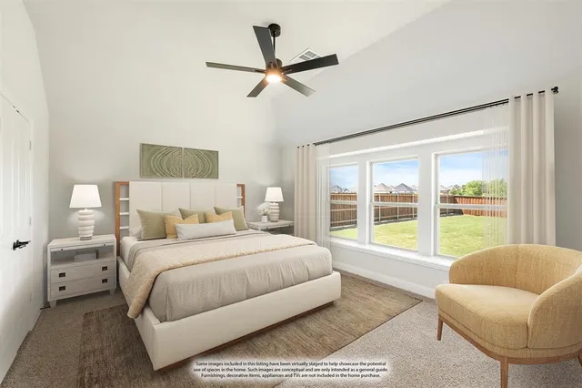 a bedroom with a large bed and a large window