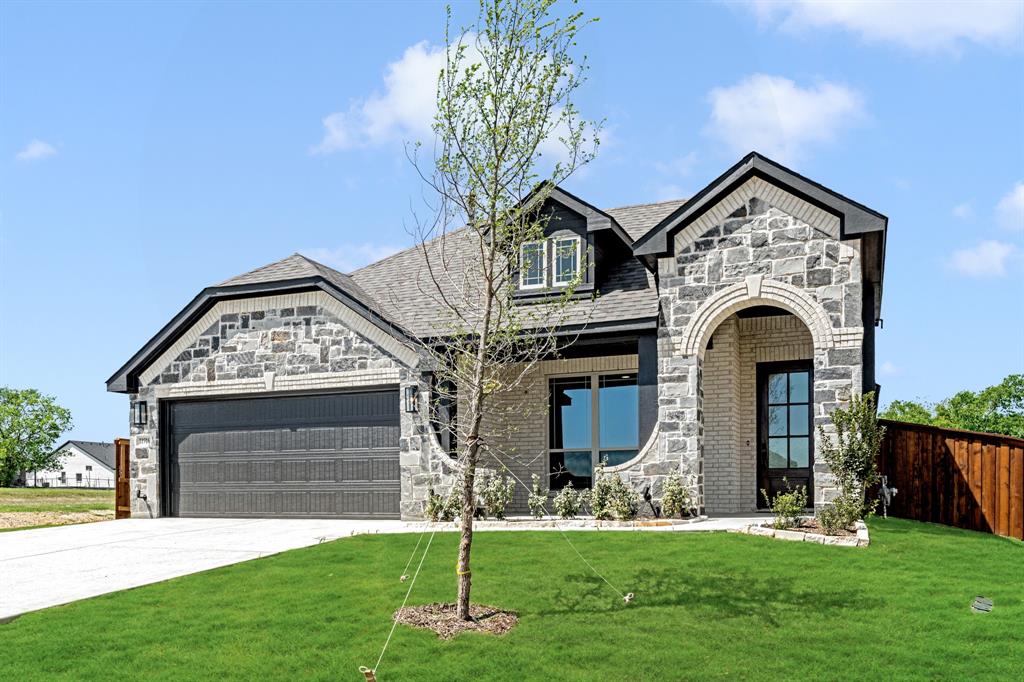11916 Serval Street Godley, TX 76044 - Photo 3 of 35 a view of a house with a yard
