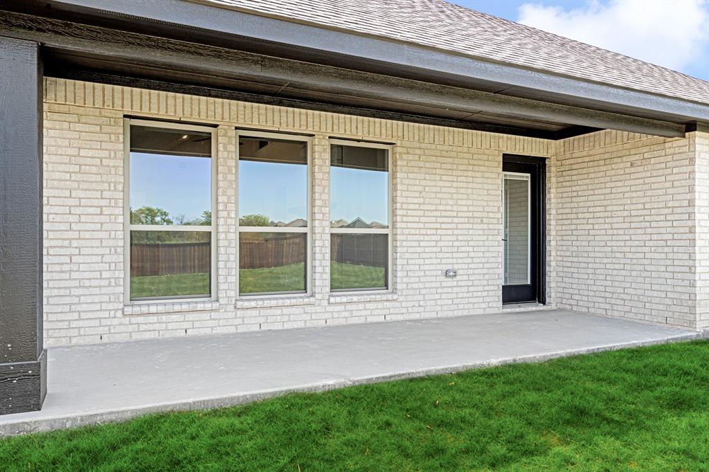 11916 Serval Street Godley, TX 76044 - Photo 31 of 35 a front view of a house with a yard