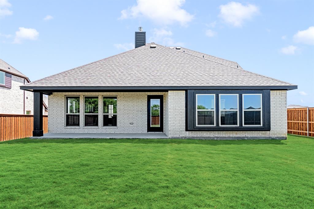 11916 Serval Street Godley, TX 76044 - Photo 33 of 35 a view of a house with a garden
