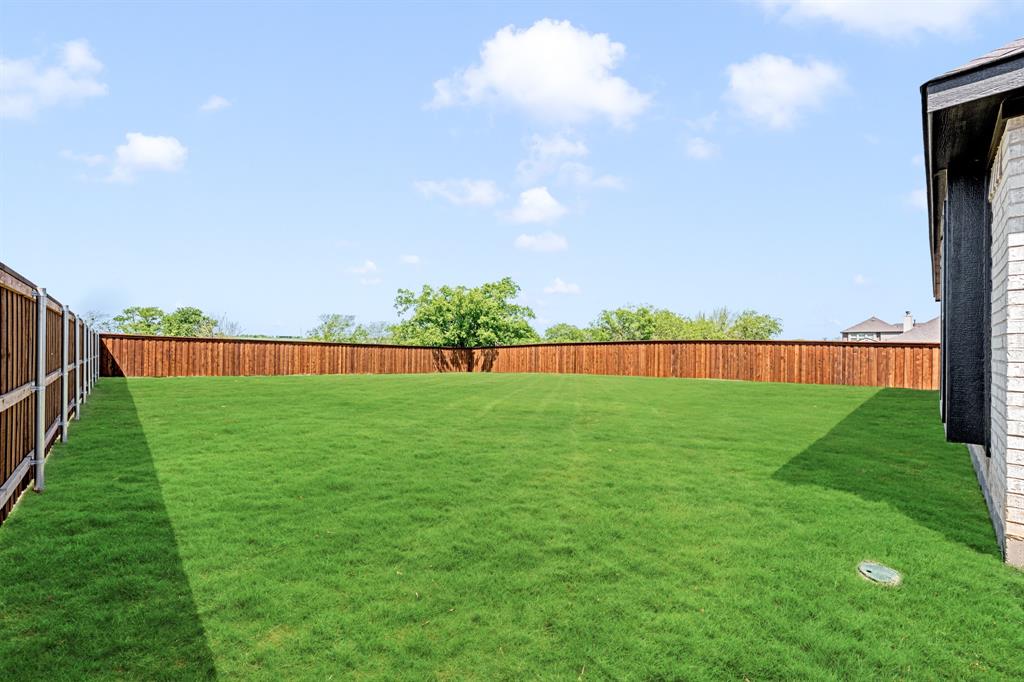11916 Serval Street Godley, TX 76044 - Photo 34 of 35 a view of green field with fence
