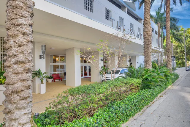 a view of a building with potted plants