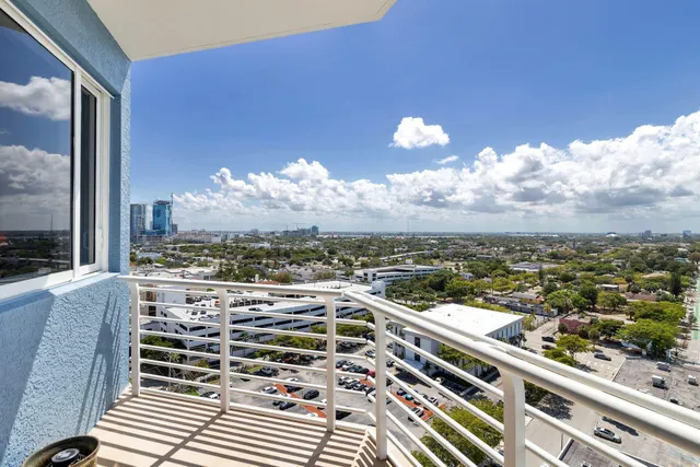 a view of a balcony with city view