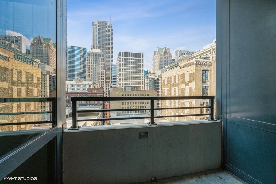 235 West Van Buren Street, Unit 1822 Chicago, IL 60607 - Photo 22 of 29 a view of a living room with furniture