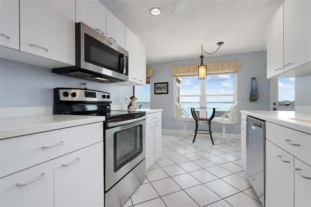 a bedroom with a bed and a lamp