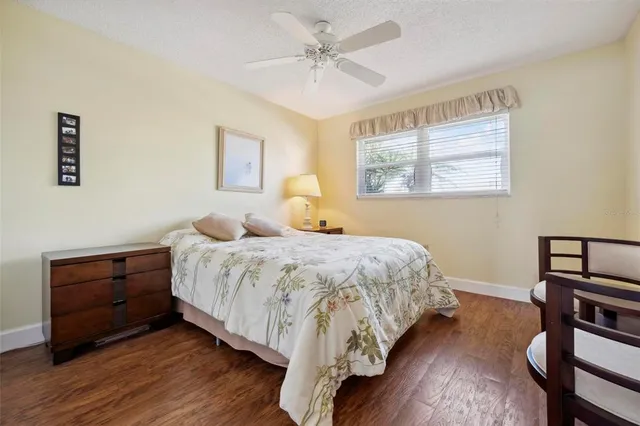 a room with pool table and windows