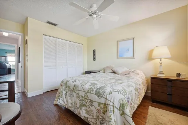 a view of a livingroom with workspace and a bookshelf