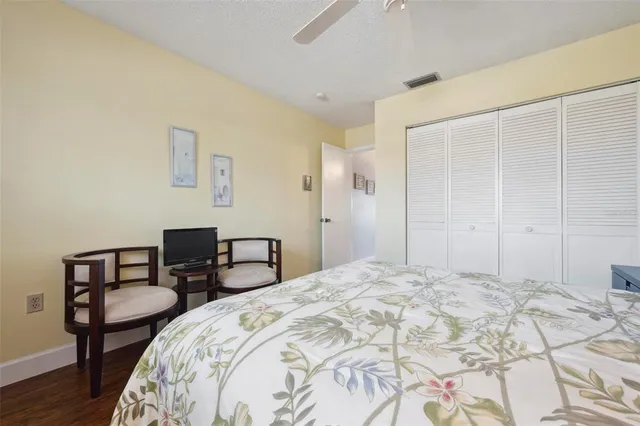 a view of a room with lots of furniture and white cabinets