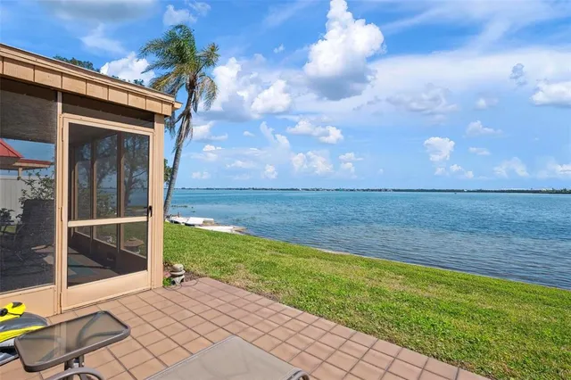 a view of a room with gym equipment and floor to ceiling window