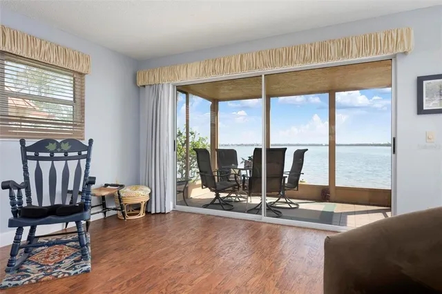 a bedroom with two large bed and a flat tv screen on dresser