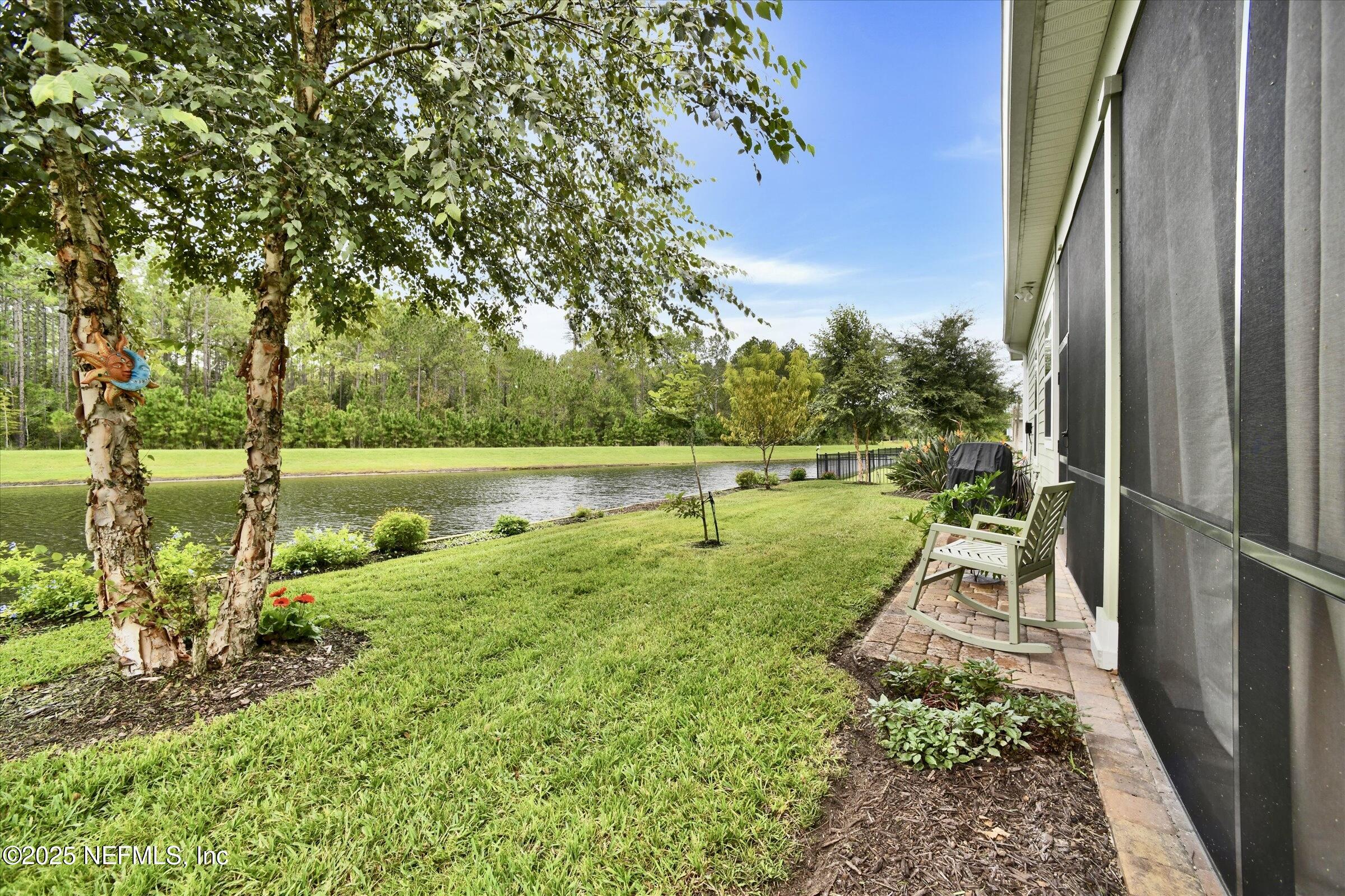 166 Oleta Way St. Augustine, FL 32095 - Photo 26 of 29 a view of a lake with a yard