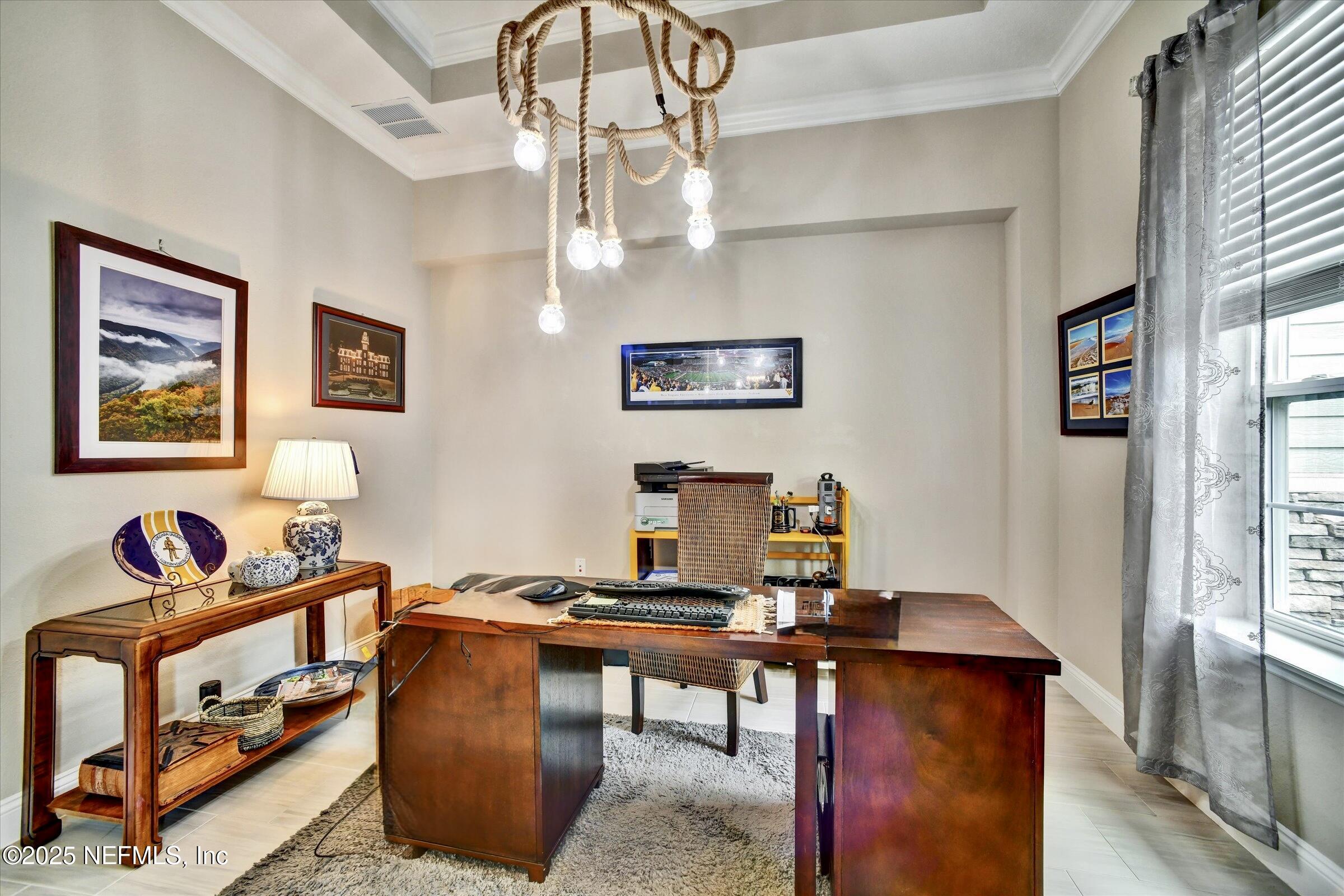 166 Oleta Way St. Augustine, FL 32095 - Photo 5 of 29 a view of a workspace with furniture and a window