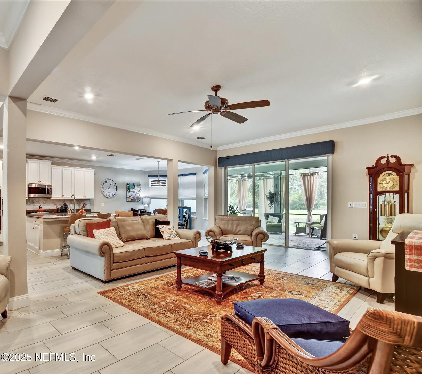 166 Oleta Way St. Augustine, FL 32095 - Photo 8 of 29 a living room with furniture a rug and a large window