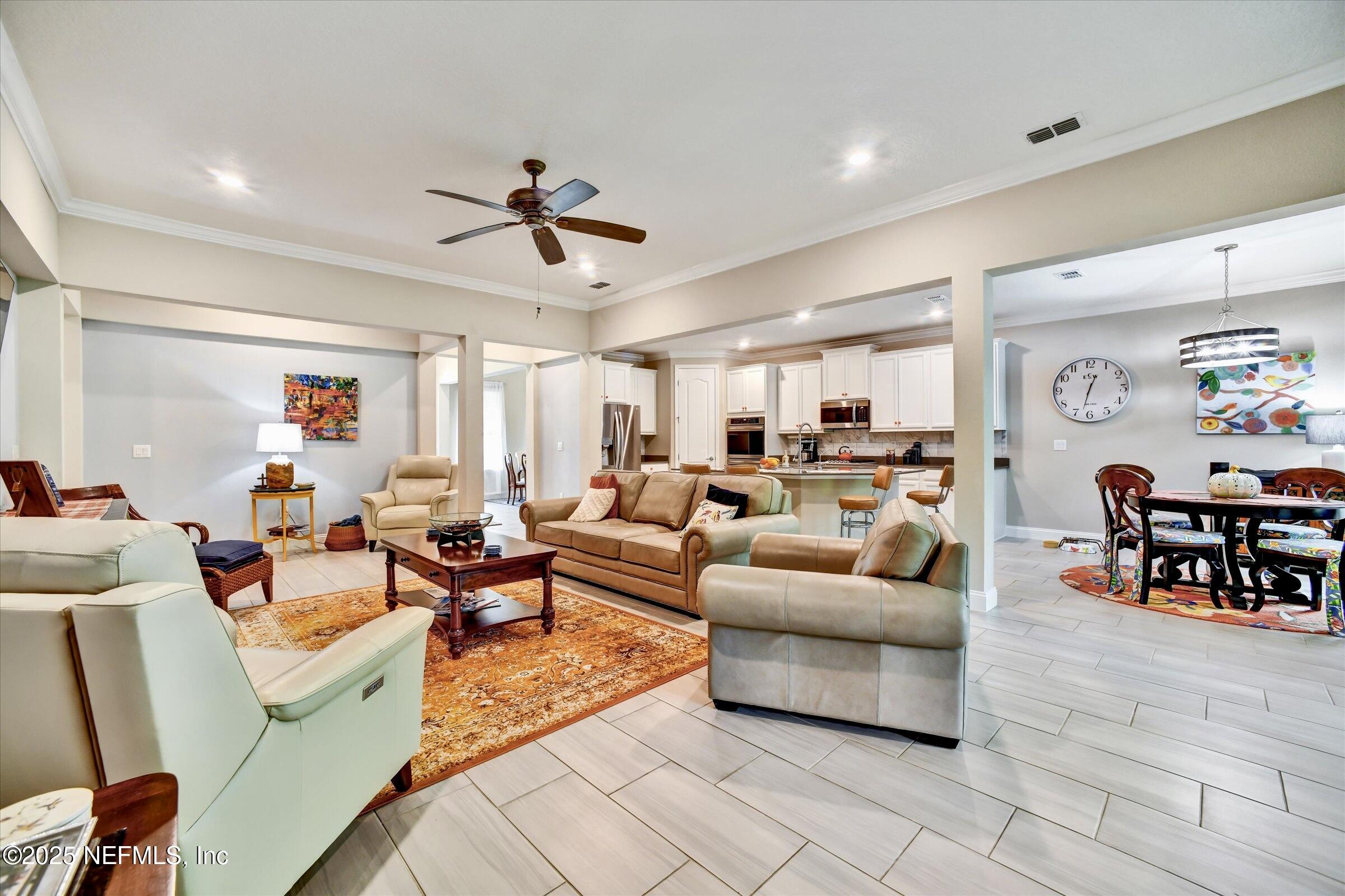 166 Oleta Way St. Augustine, FL 32095 - Photo 9 of 29 a living room with furniture and wooden floor