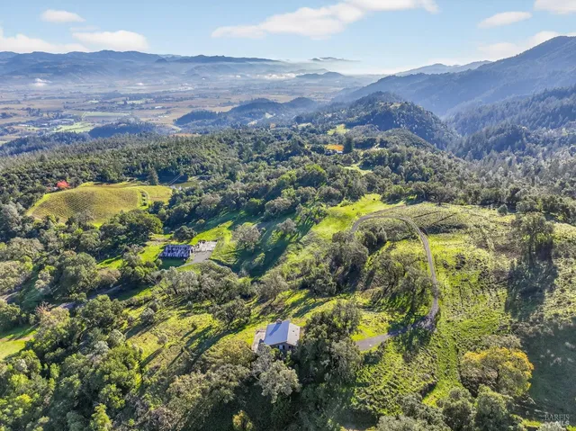 a kitchen with a sink a stove and cabinets