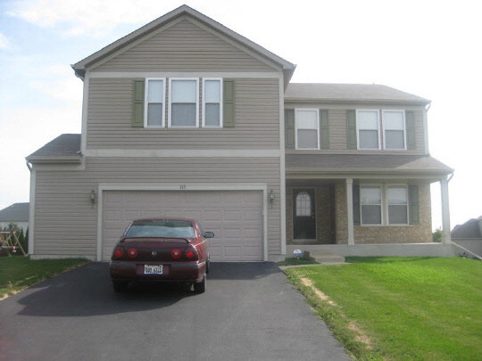 315 Ridgestone Trail Poplar Grove, IL 61065 - Photo 1 of 10 a car parked in front of a house