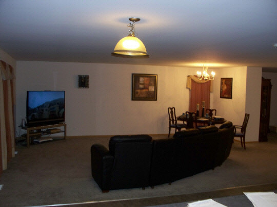315 Ridgestone Trail Poplar Grove, IL 61065 - Photo 3 of 10 a living room with furniture and a flat screen tv