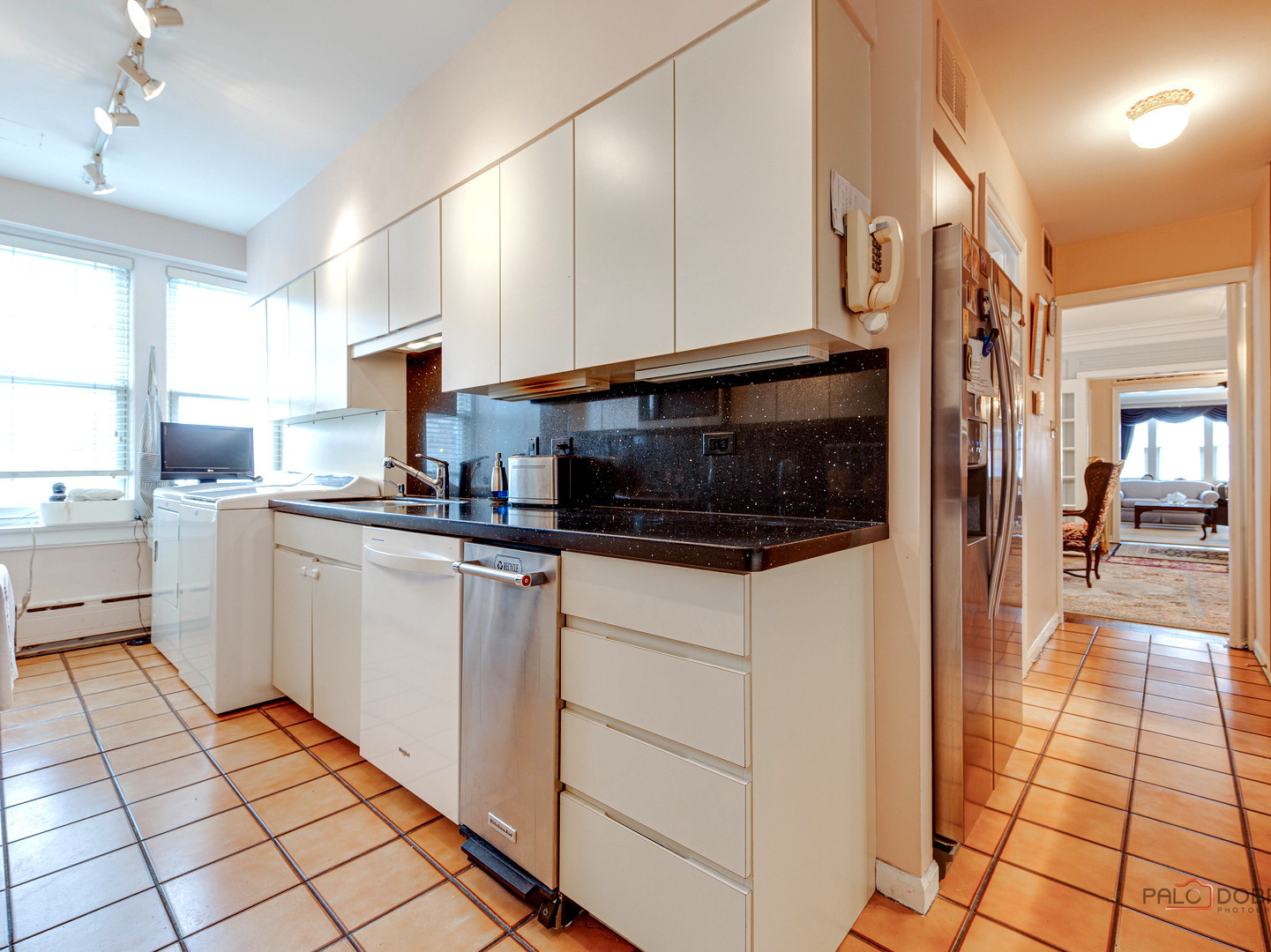 6342 North Sheridan Road, Unit 2B Chicago, IL 60660 - Photo 15 of 18 a kitchen with a sink and cabinets
