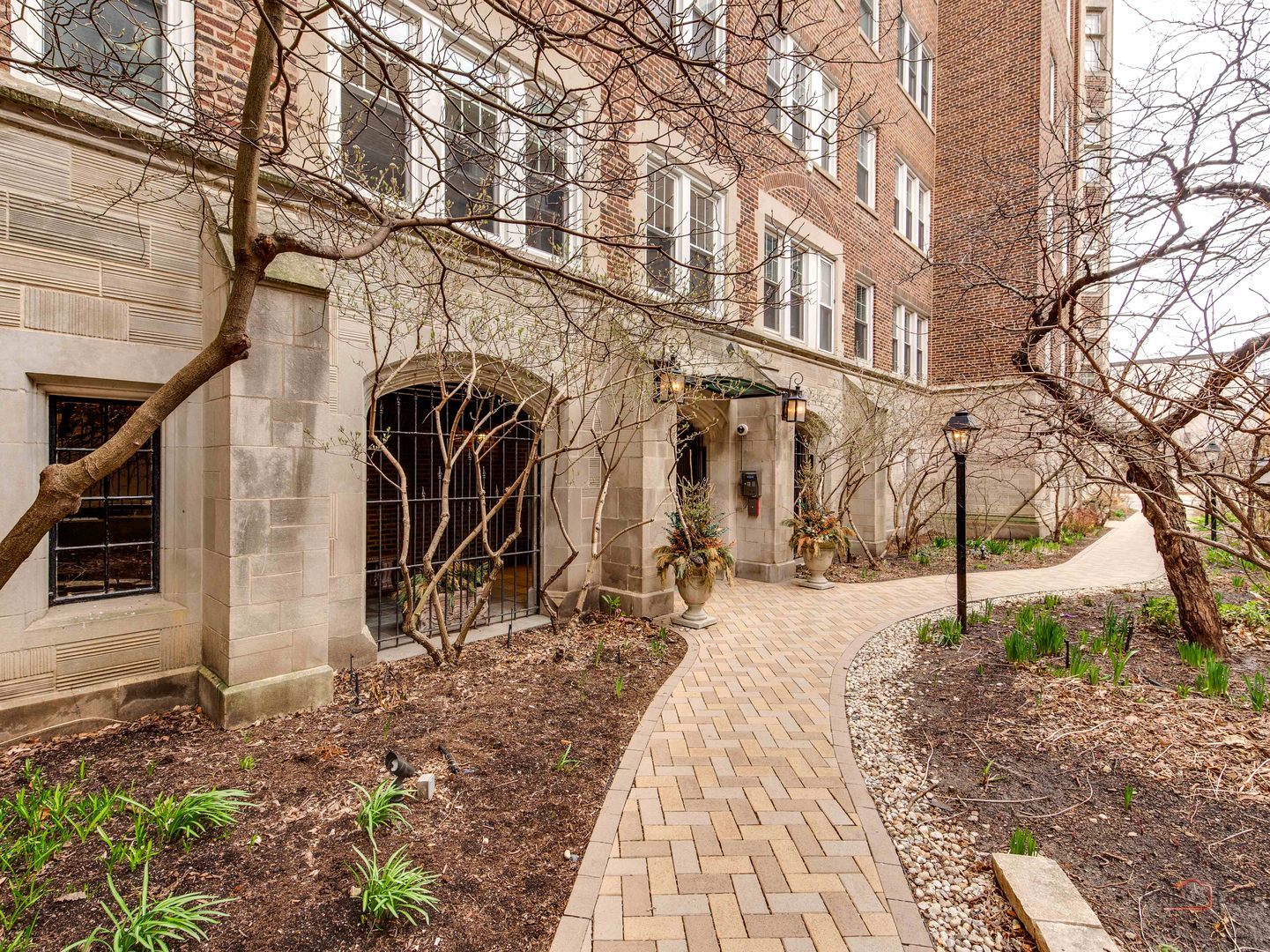 6342 North Sheridan Road, Unit 2B Chicago, IL 60660 - Photo 3 of 18 a view of a building with a yard