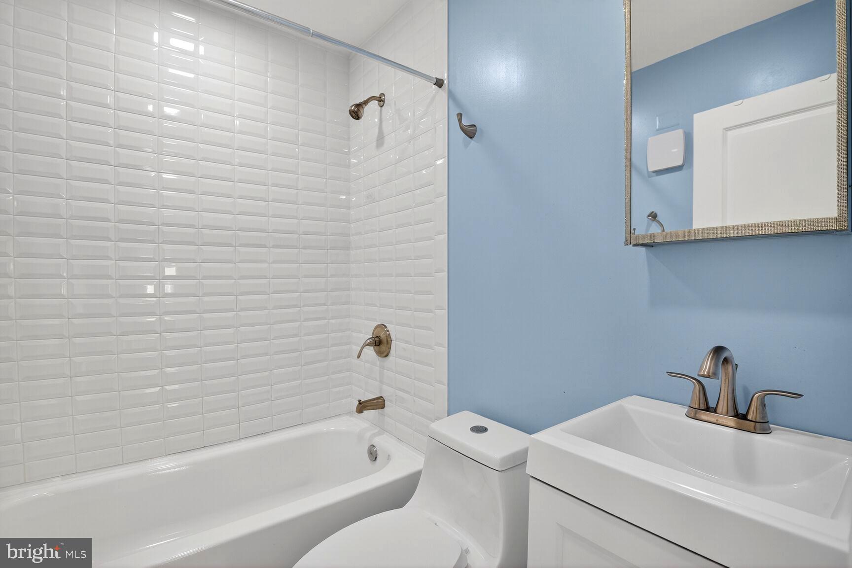 8204 17th Avenue Hyattsville, MD 20783 - Photo 20 of 36 a bathroom with a sink and a bathtub