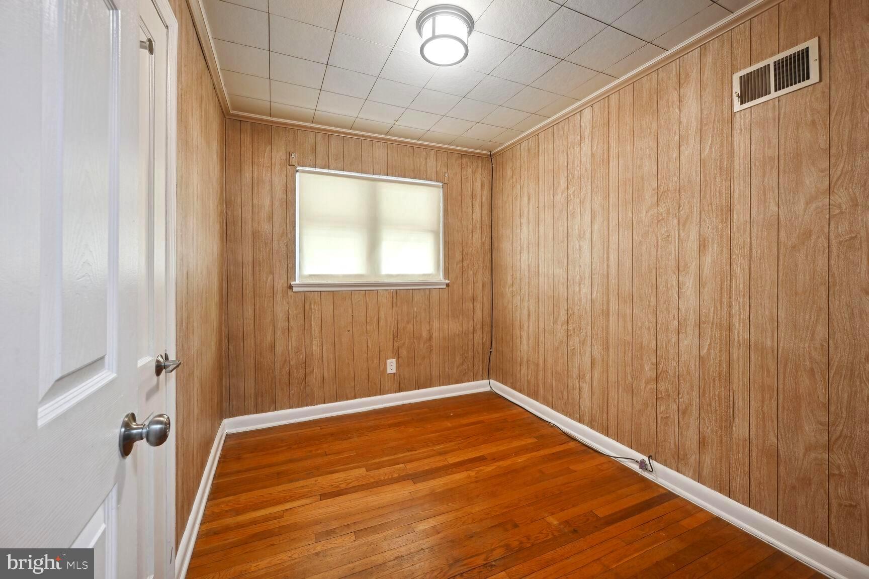 8204 17th Avenue Hyattsville, MD 20783 - Photo 21 of 36 a view of a room with wooden floor and a window