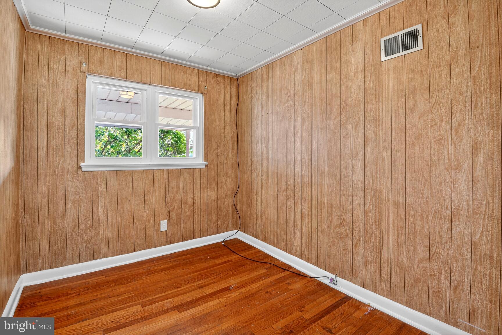 8204 17th Avenue Hyattsville, MD 20783 - Photo 23 of 36 a view of a room with wooden floor and a window