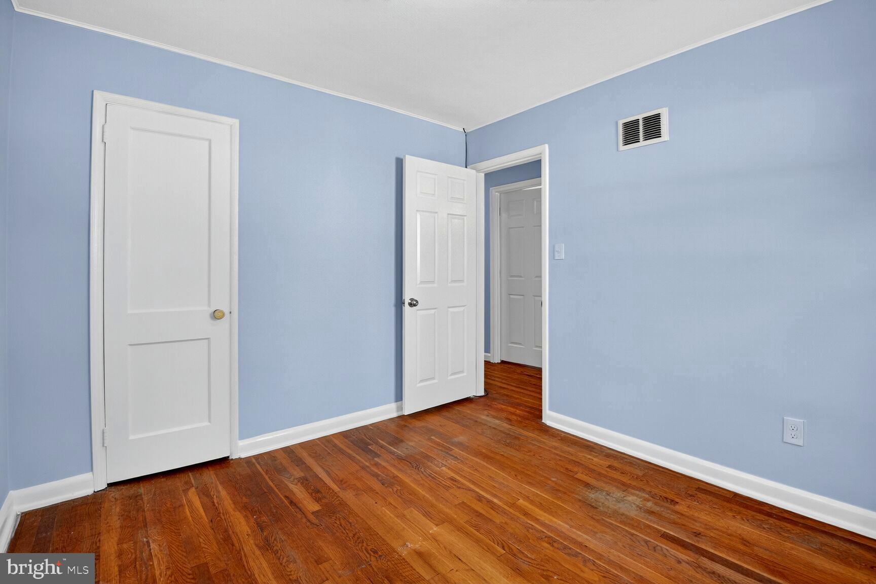 8204 17th Avenue Hyattsville, MD 20783 - Photo 27 of 36 a view of an empty room with wooden floor