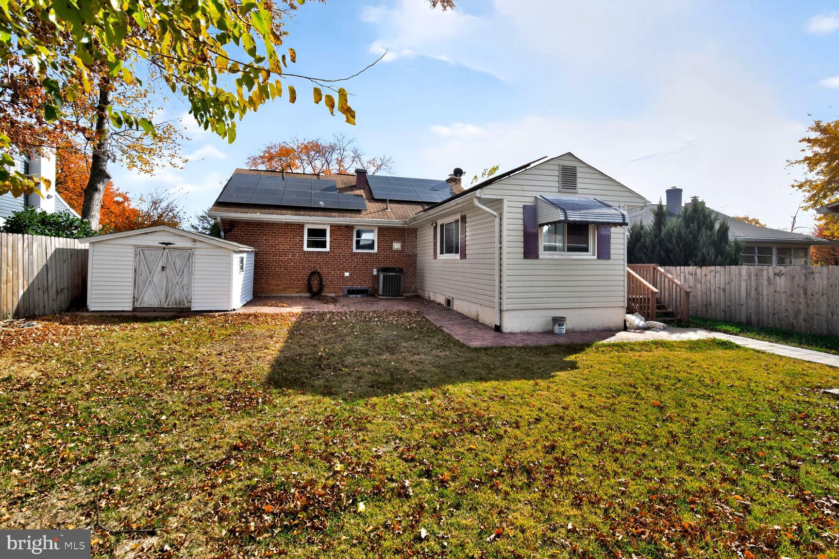 8204 17th Avenue Hyattsville, MD 20783 - Photo 35 of 36 a front view of a house with a yard and garage